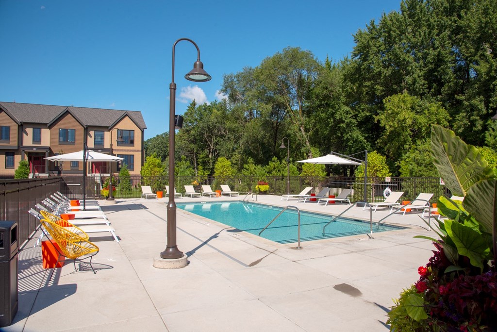 Relaxing Pool Area With Sundeck at The McMillan, Shoreview, MN, 55126