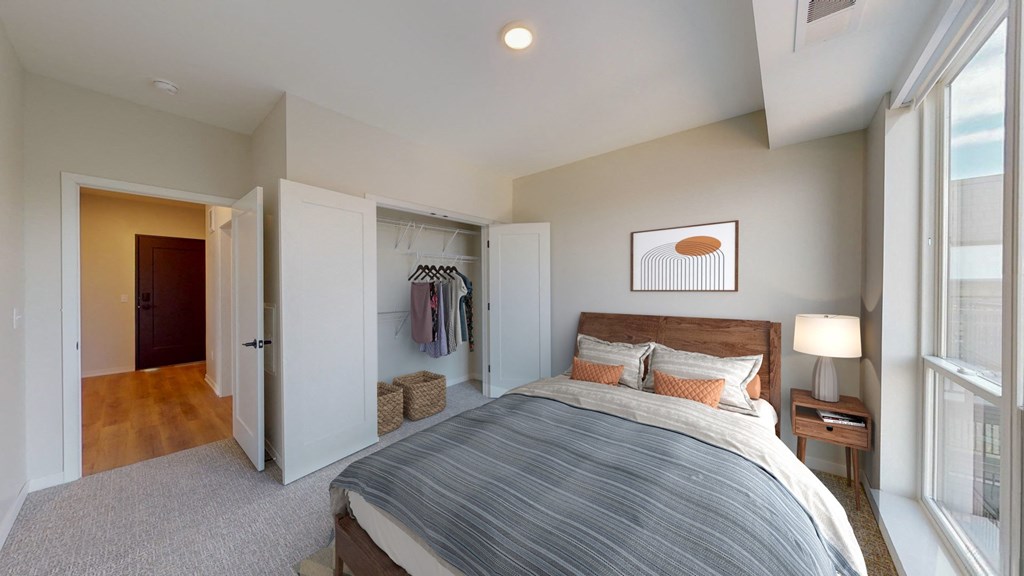 a bedroom with a bed and a closet