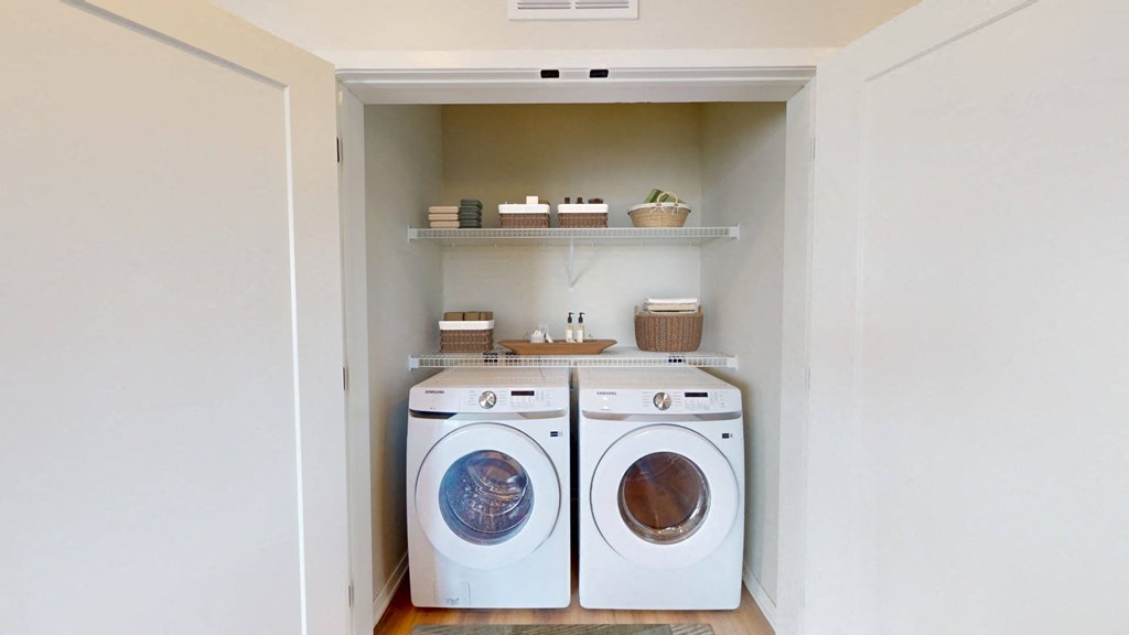 a small laundry room with a washing machine and a dryer
