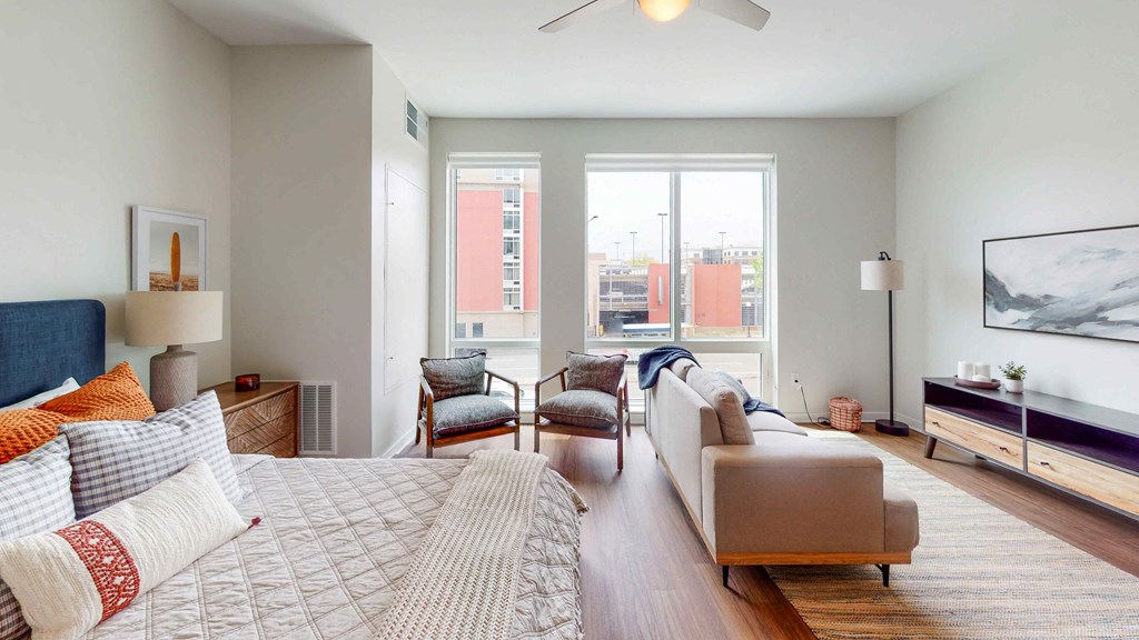 a living room with a couch and a large window