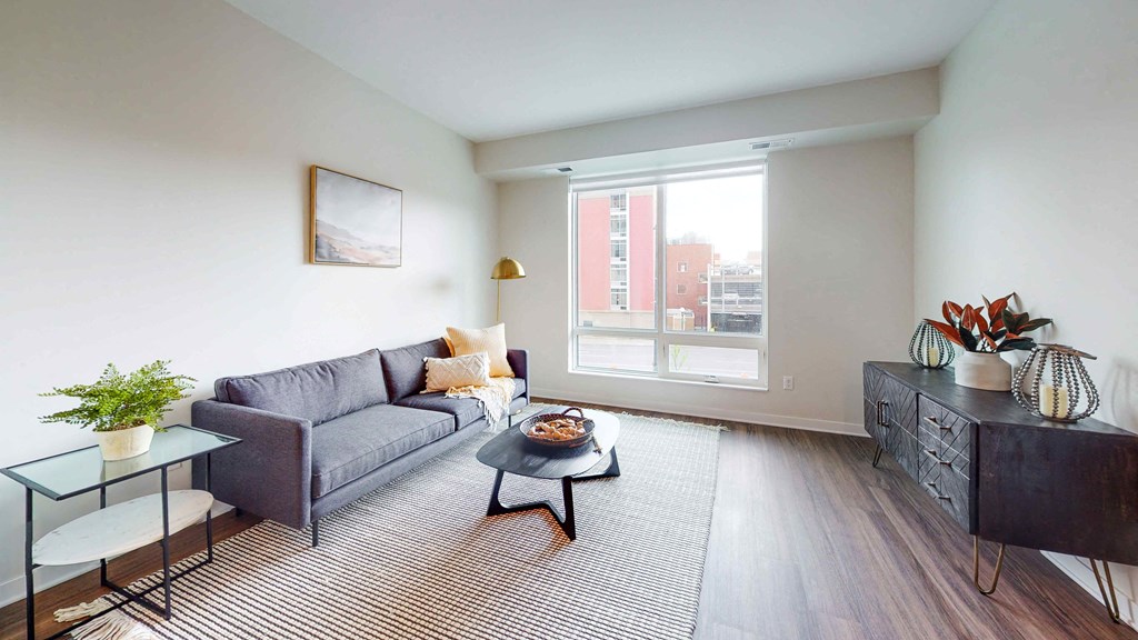 a living room with a couch and a large window