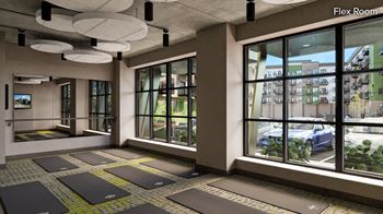 a rendering of a yoga room in the fitness center with large windows and a view of the