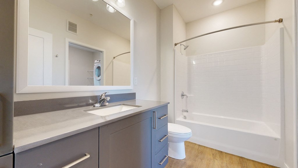 a bathroom with a toilet sink and bathtub