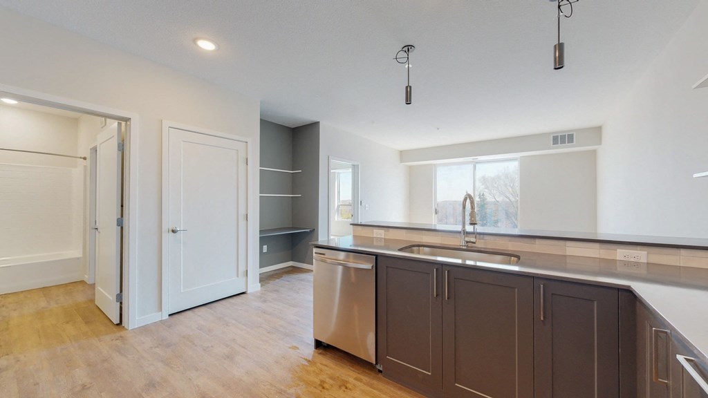 a kitchen with a sink and a window