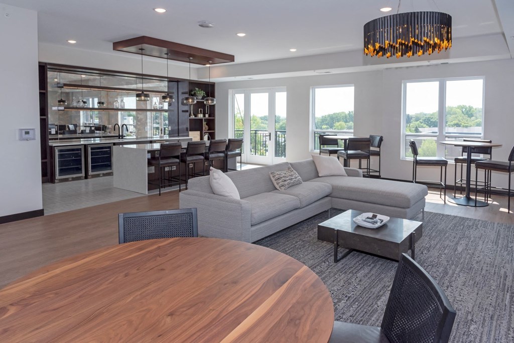 a living room filled with furniture and a large window