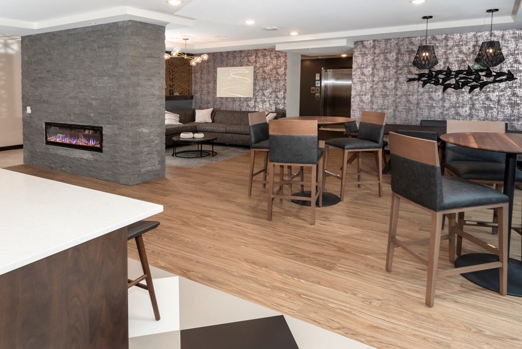 a living room filled with furniture and a fire place