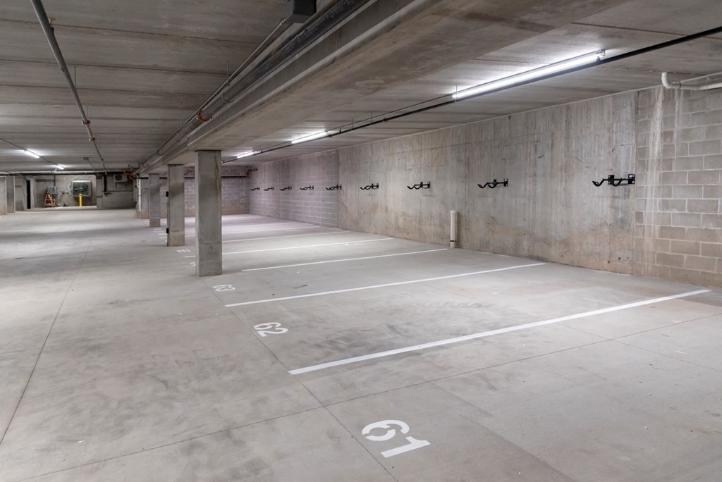 a parking garage with concrete floors and concrete walls