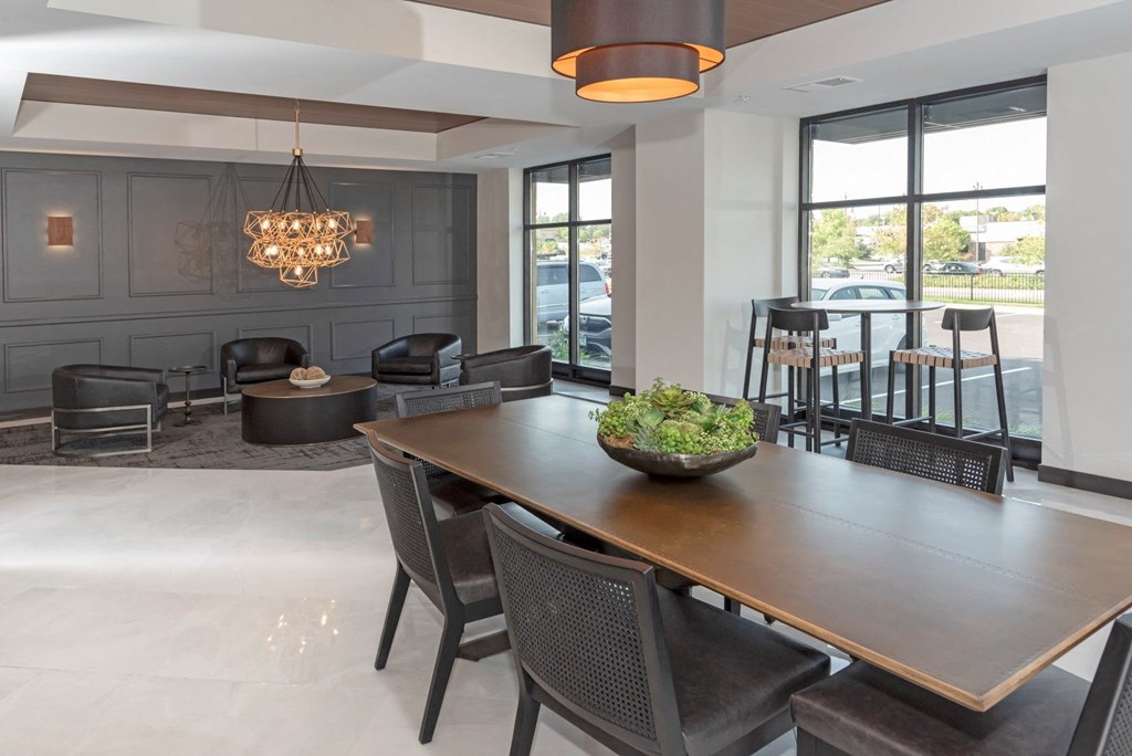 a dining room with a table and chairs