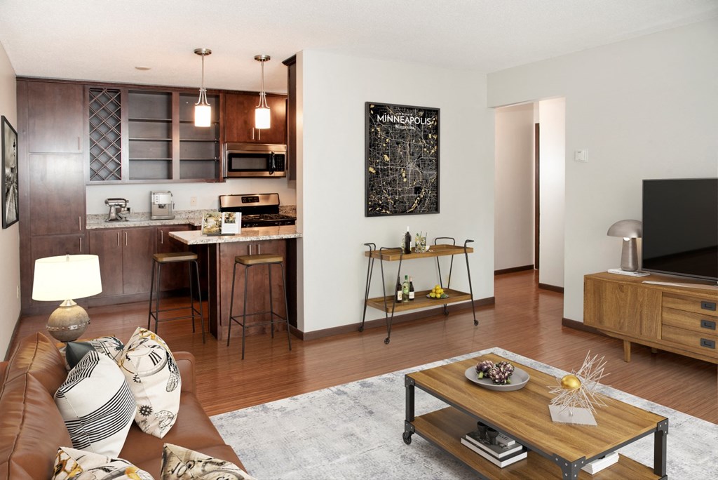 a living room and kitchen with a couch and a table