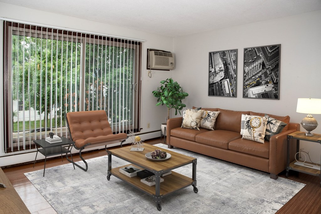 a living room with two brown couches and a coffee table