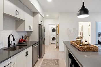 Large Kitchen Space With Modern Details and Efficient Appliances Large Kitchen Space With Modern Details and Efficient Appliances at The Hill Apartments, Minnesota - Photo Gallery 4
