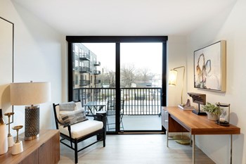 View of Balcony with glass door leading to a cityscape View of Balcony with glass door leading to a cityscape at The Hill Apartments, Saint Paul - Photo Gallery 3