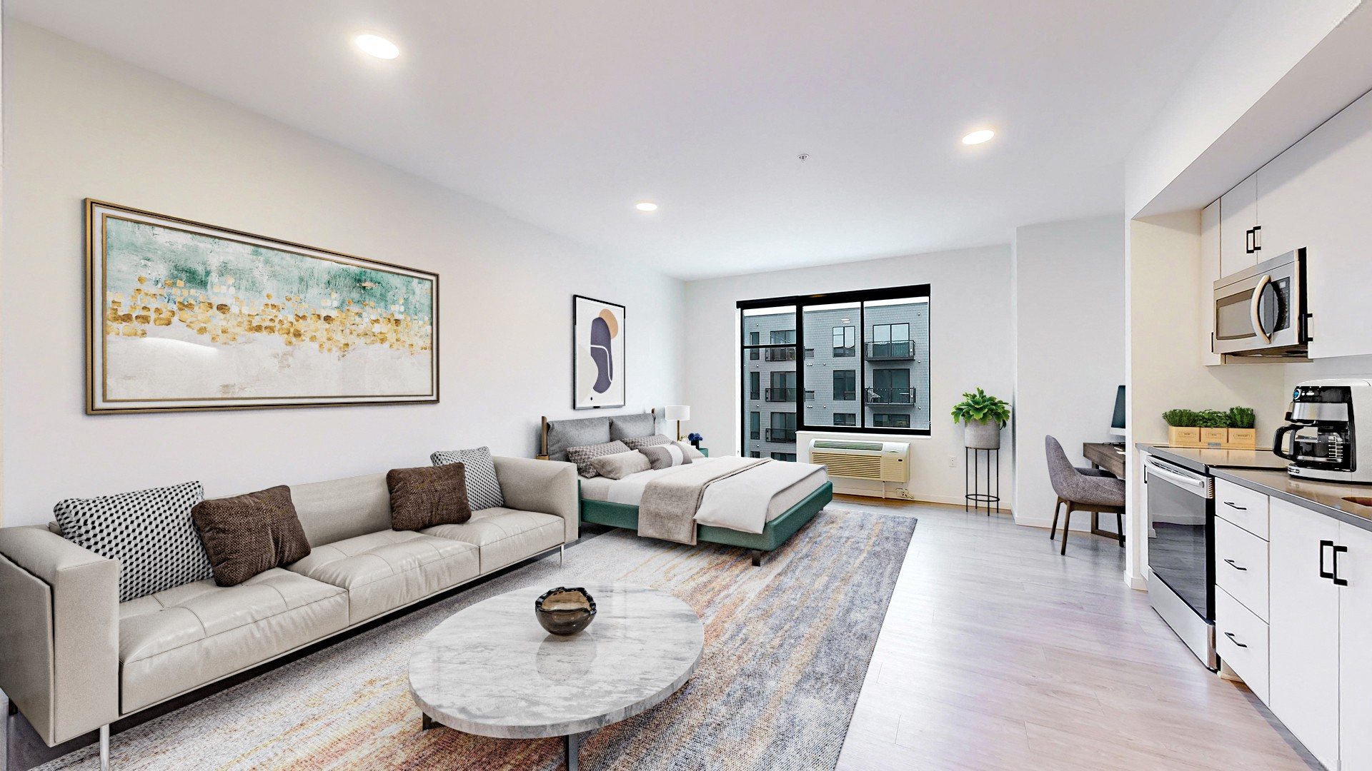 A modern living room with a grey sofa and a coffee table.