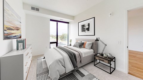 a bedroom with a bed and a large window