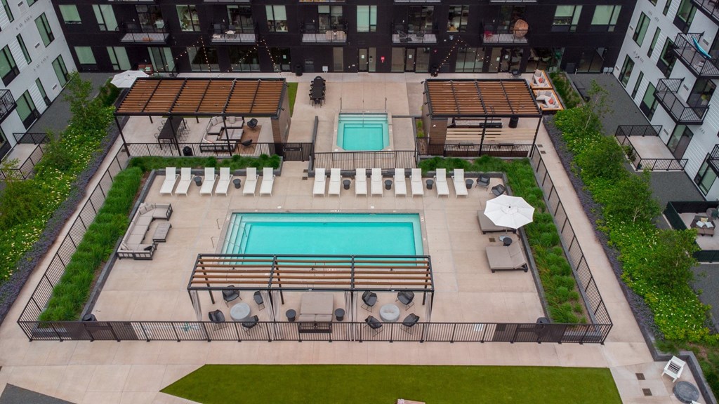 a view of the pool from the roof of an apartment building