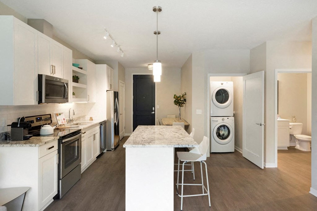 Kitchen and Laundry Space at The McMillan Apartments in Shoreview, MN 55126
