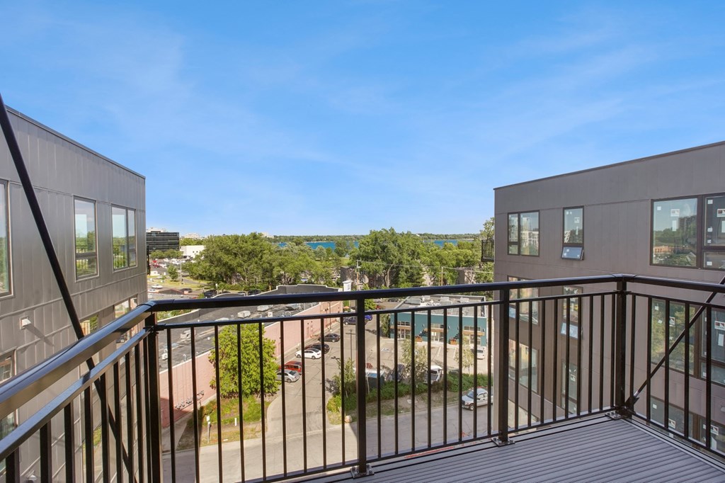 a balcony with a view of a parking lot