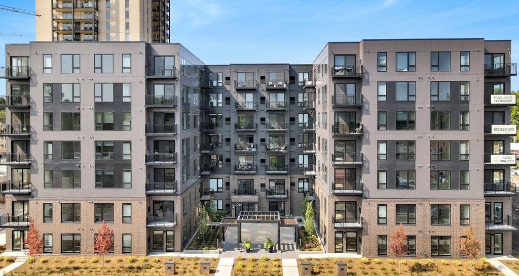 a view of a large apartment building with a staircase in front of it