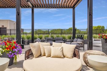 a patio with a couch and chairs at The Gateway at West Lake Quarter in Minneapolis, MN