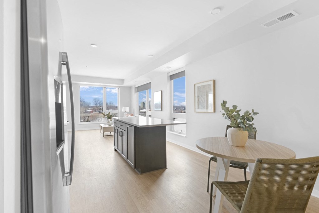 a kitchen and dining area in a 555 waverly unit