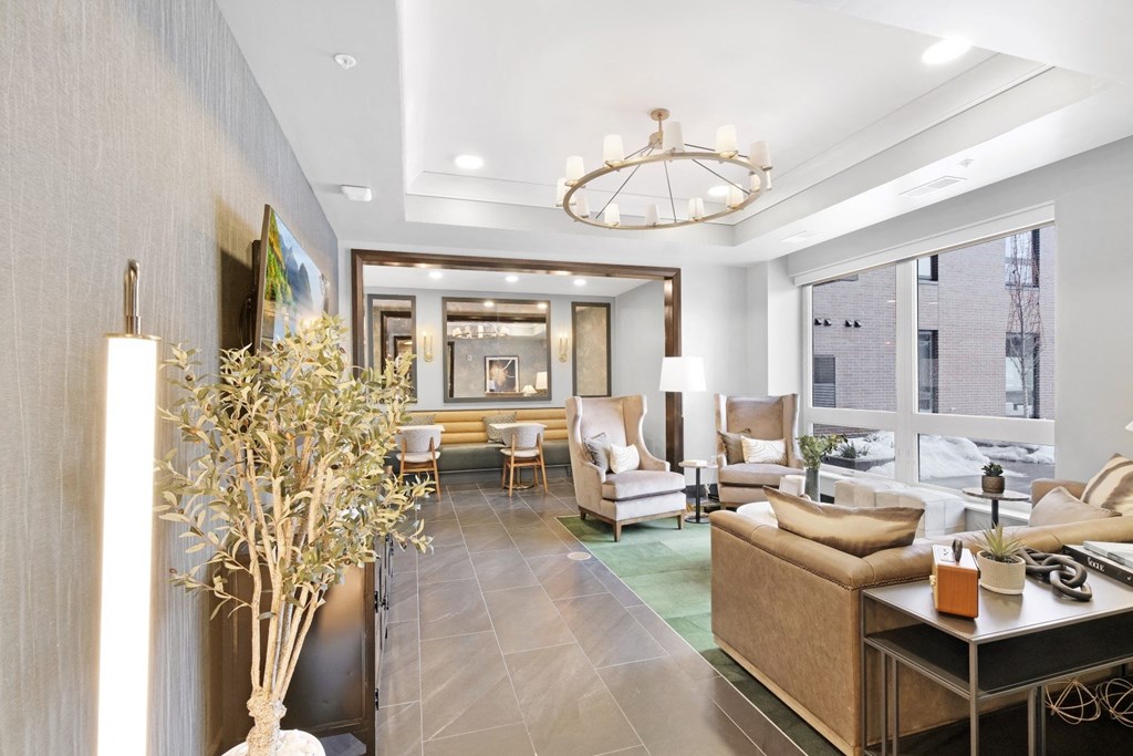 a living room filled with furniture and a large window