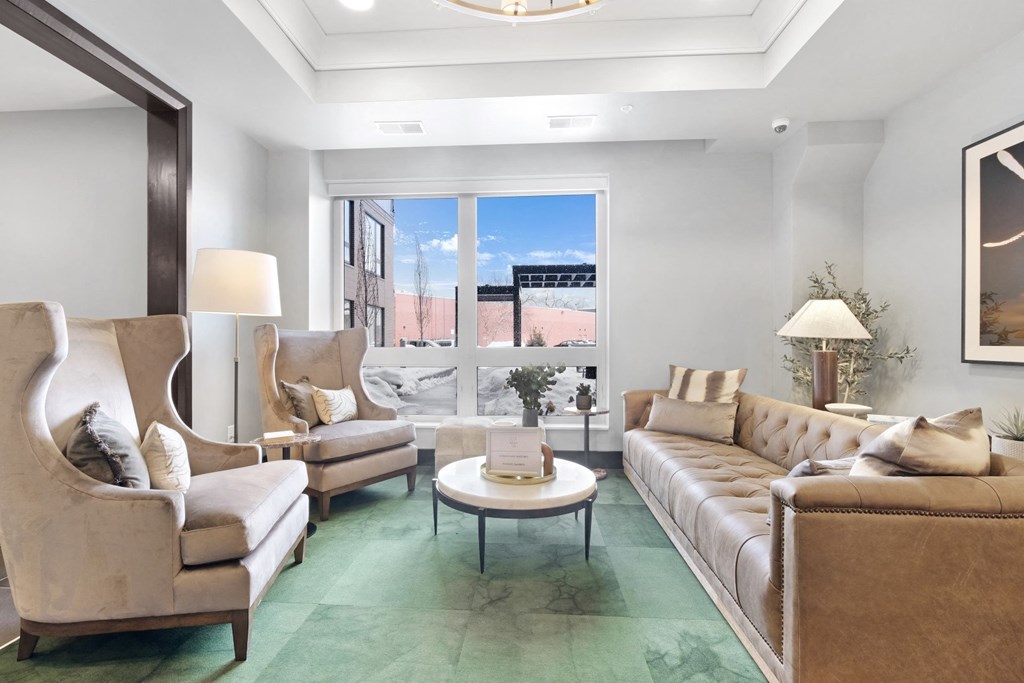 a living room with couches chairs and a coffee table