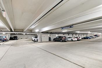 A parking garage with a sign that reads "MERCHANDISE" is shown.