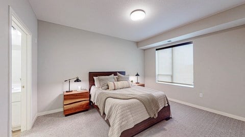 a bedroom with a bed and two night stands
