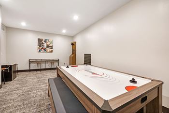 a game room with a ping pong table