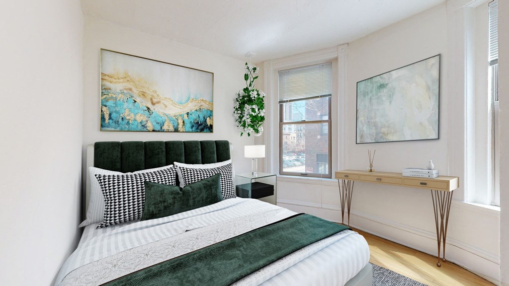 a bedroom with a bed and two windows