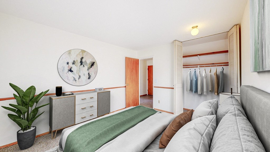 a bedroom with a bed and a closet