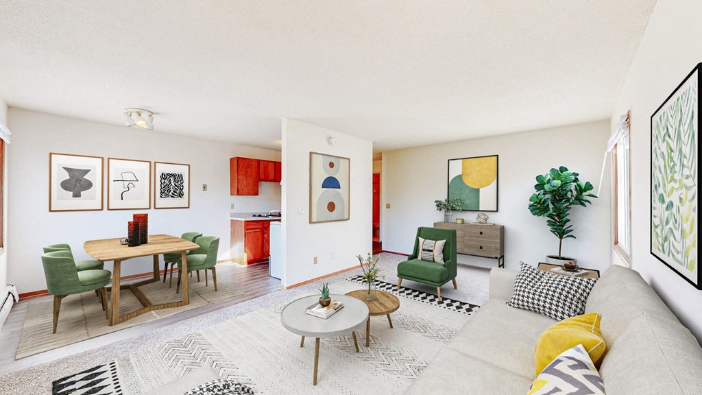 a living room with a couch and chairs and a dining table