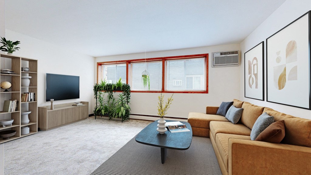 a living room with a brown couch and a coffee table