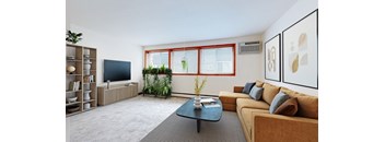 a living room with a brown couch and a coffee table
