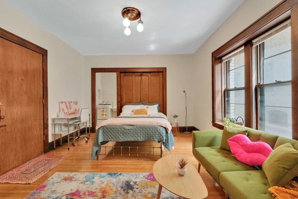 a bedroom with a bed and a couch