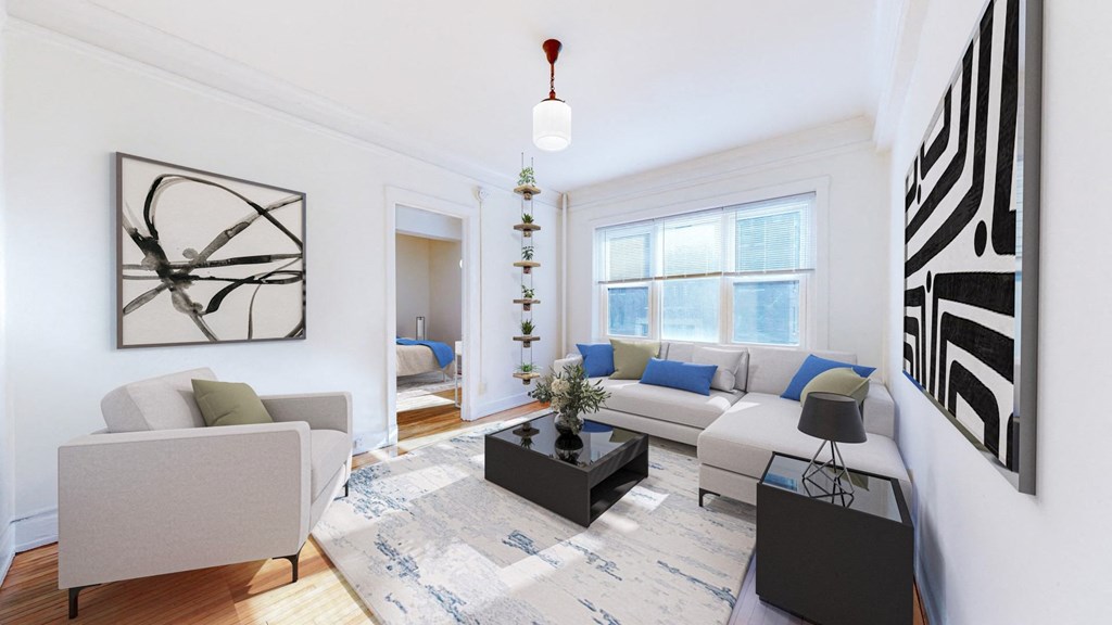 Living Room with Modern Decor, Natural Restored Hardwood Flooring, and Wide Windows at The Park Apartments in Minneapolis, MN
