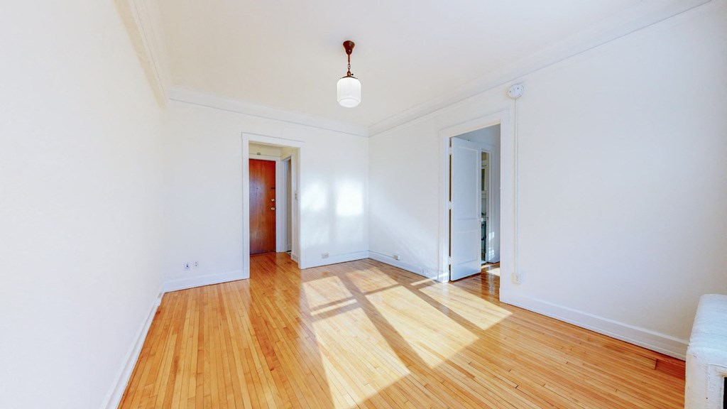 An Open-Style Living Room with Gorgeous Restored Hardwood Flooring at The Park Apartments in Minneapolis
