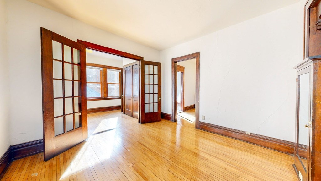 Double French Doors with Grid Pattern in Glass leading to Sitting Room at The Park Apartments in Minneapolis, MN