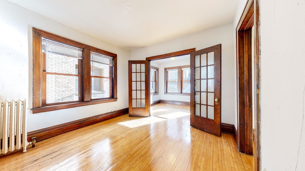 Gorgeous Apartment with French Double Doors with Grid Glass Pattern and Dark Contrasting Wood Trim at The Park Apartments in Minneapolis