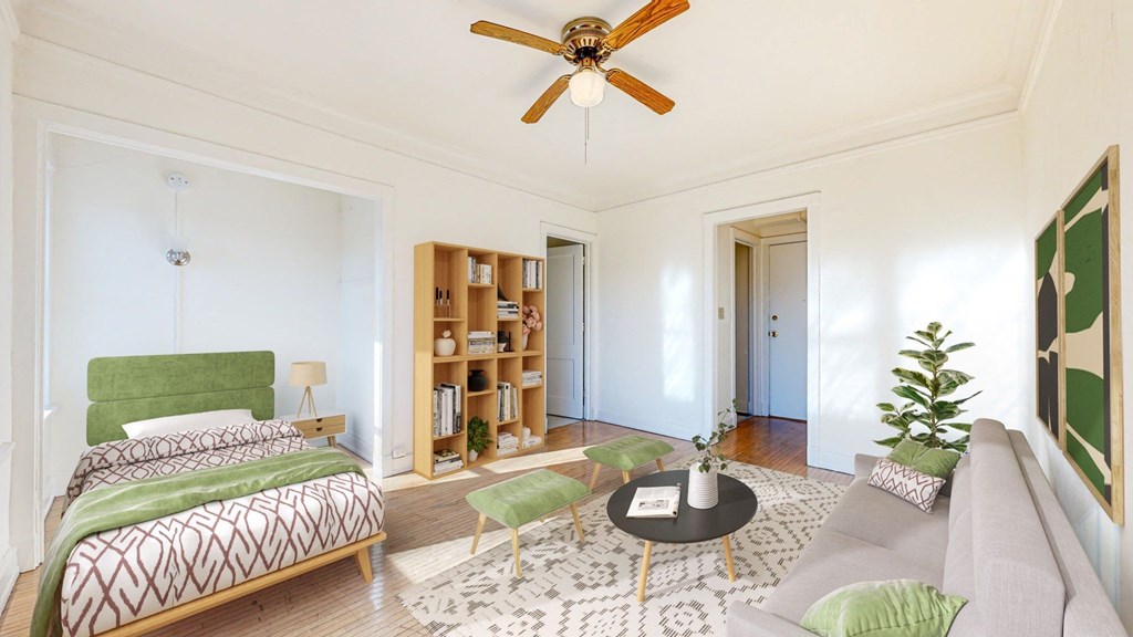 Spacious Bedroom with Intricate Bookshelves and Restored Hardwood Flooring at The Park Apartments in Minneapolis, 55403
