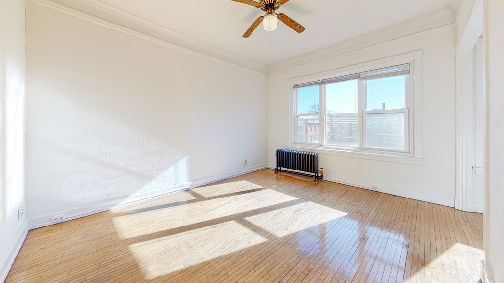 Apartment Layout with Restored Hardwood Floors, a Ceiling Fan, and Views Overlooking the City at The Park Apartments in Minneapolis, MN