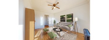 a living room with white walls and a ceiling fan