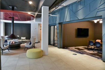 The Redwell Affordable apartments community lobby lounge - Photo Gallery 3