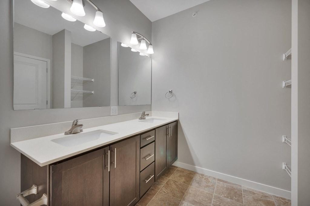 a bathroom with a large mirror and a sink