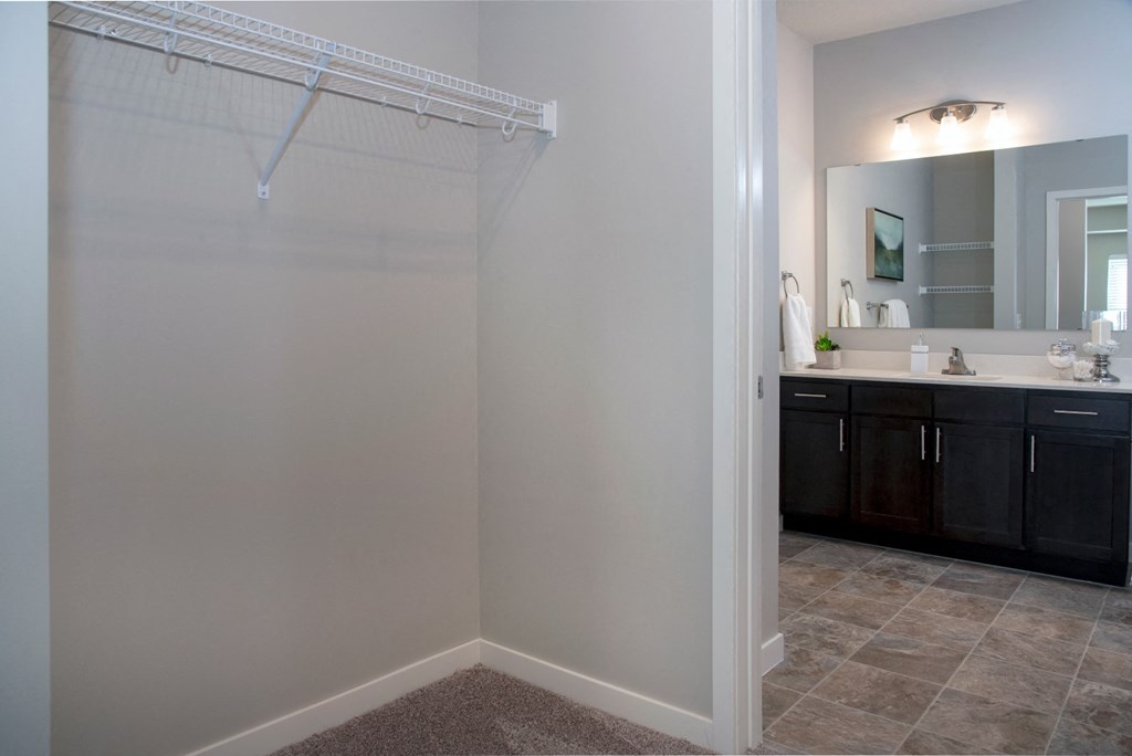 Large walk in closet and double vanity bathroom at The Sixton apartments in Shakopee, MN