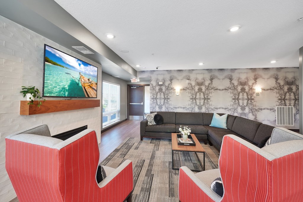 a living room with couches and a tv