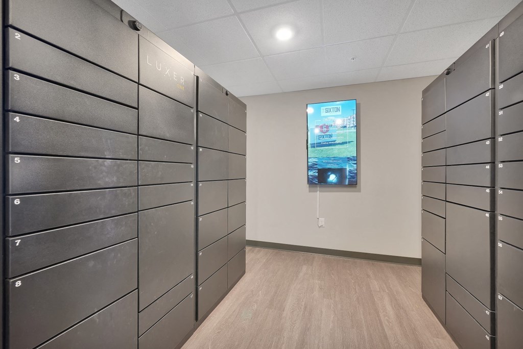 the lockers in a room with a television on the wall