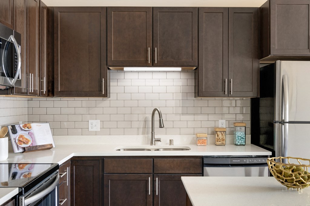 Dark espresso Kitchen Cabinets at The Sixton Apartments Shakopee MN
