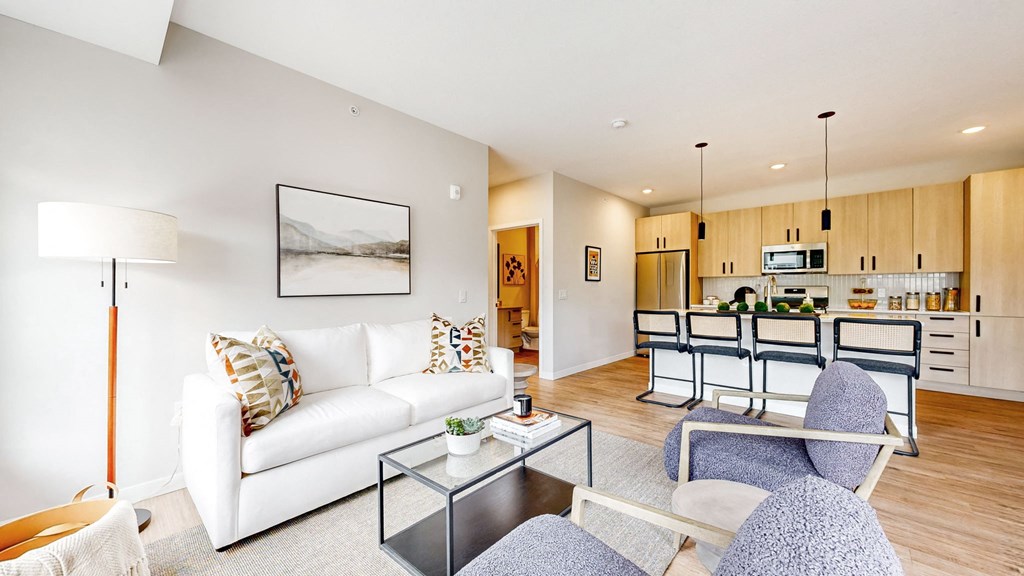 a living room with a couch and a glass table