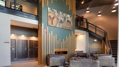 A large artwork of a wolf is on the wall of a room.
